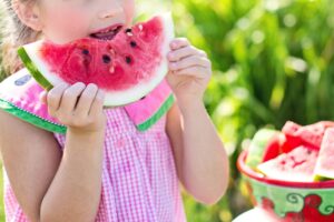 child-eating-watermelon-to-represent-summer-childcare