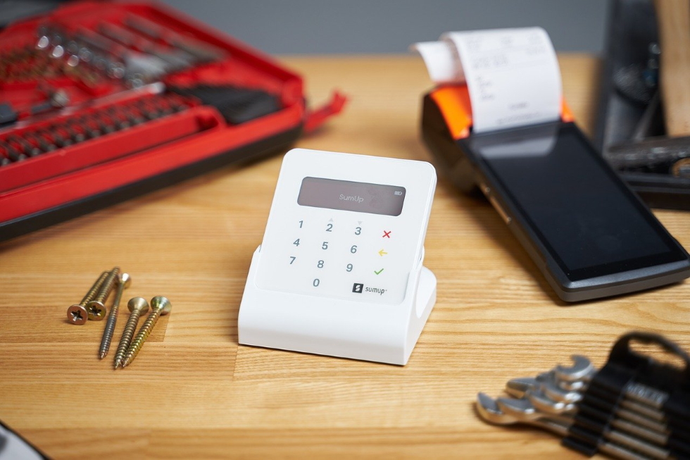 Image of a card reader and tools to represent VAT registered businesses