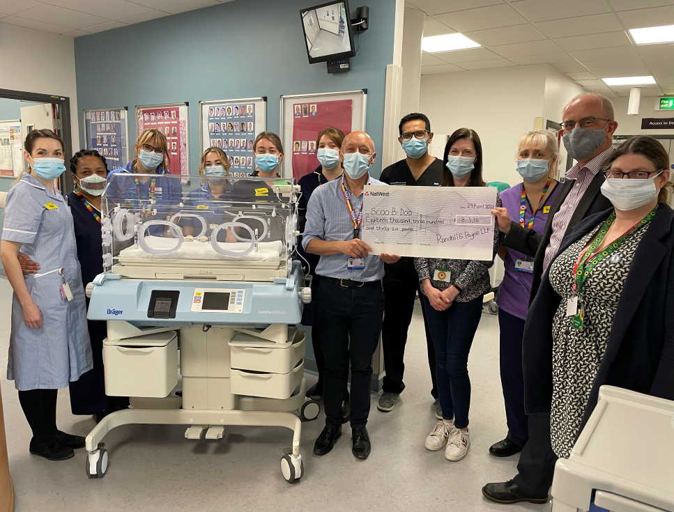 Randall & Payne present cheque for Scoo-B-Doo to the team at the neonatal unit at Gloucestershire Royal Hospital to buy an incubator